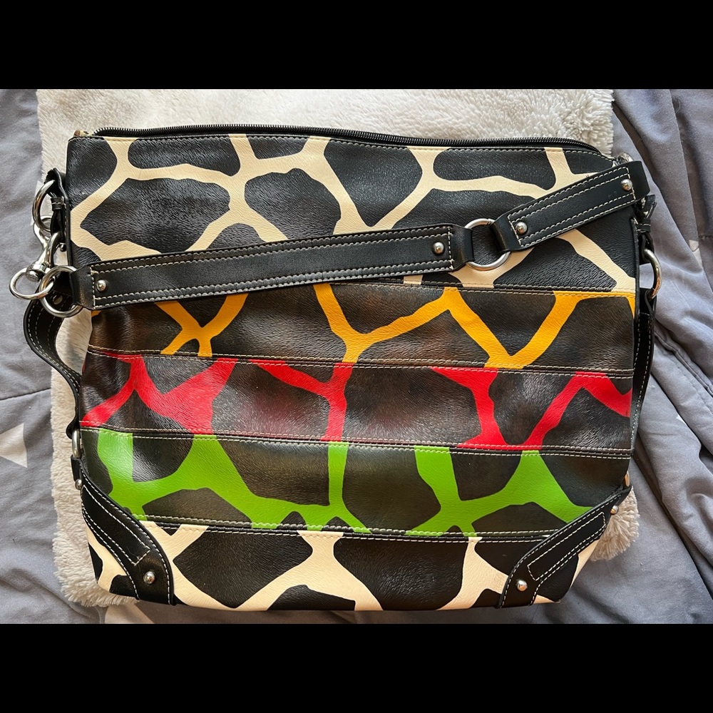 Giraffe print handbag with convertible shoulder strap
